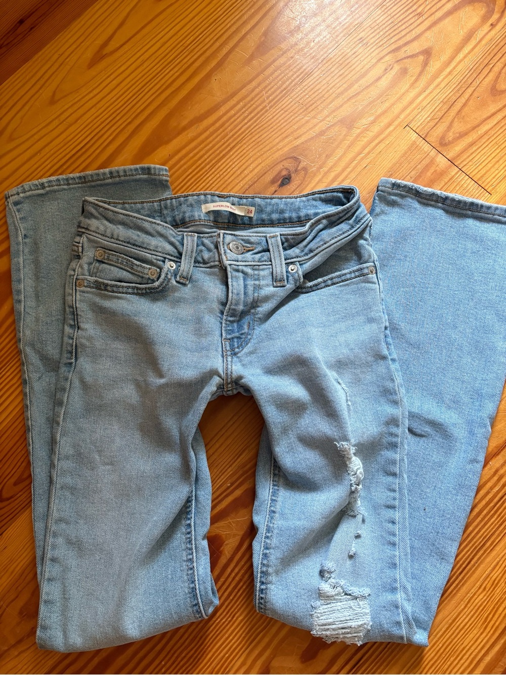 Levi's Light Blue Flare Jeans with Distressed Knee